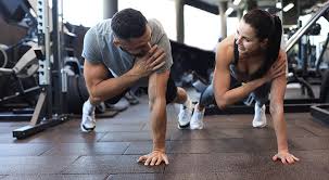 Fitness trainer demonstrating arm toning exercises Aldershot
