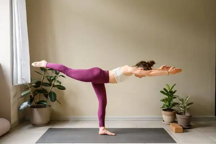 Woman doing Yoga exercise Aldershot to help with toning the body. 